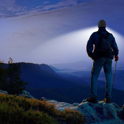 Hiker looking off into the distance while using the PowerCap beanie to see