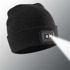 Black beanie with a built-in flashlight on a light gray background