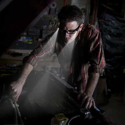 car mechanic wearing LIGHTSPECS vindicator LED lighted safety glasses