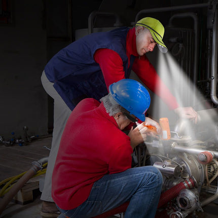 two men wearing POWER 25/10 LED lighted safety hats while doing mechanical work